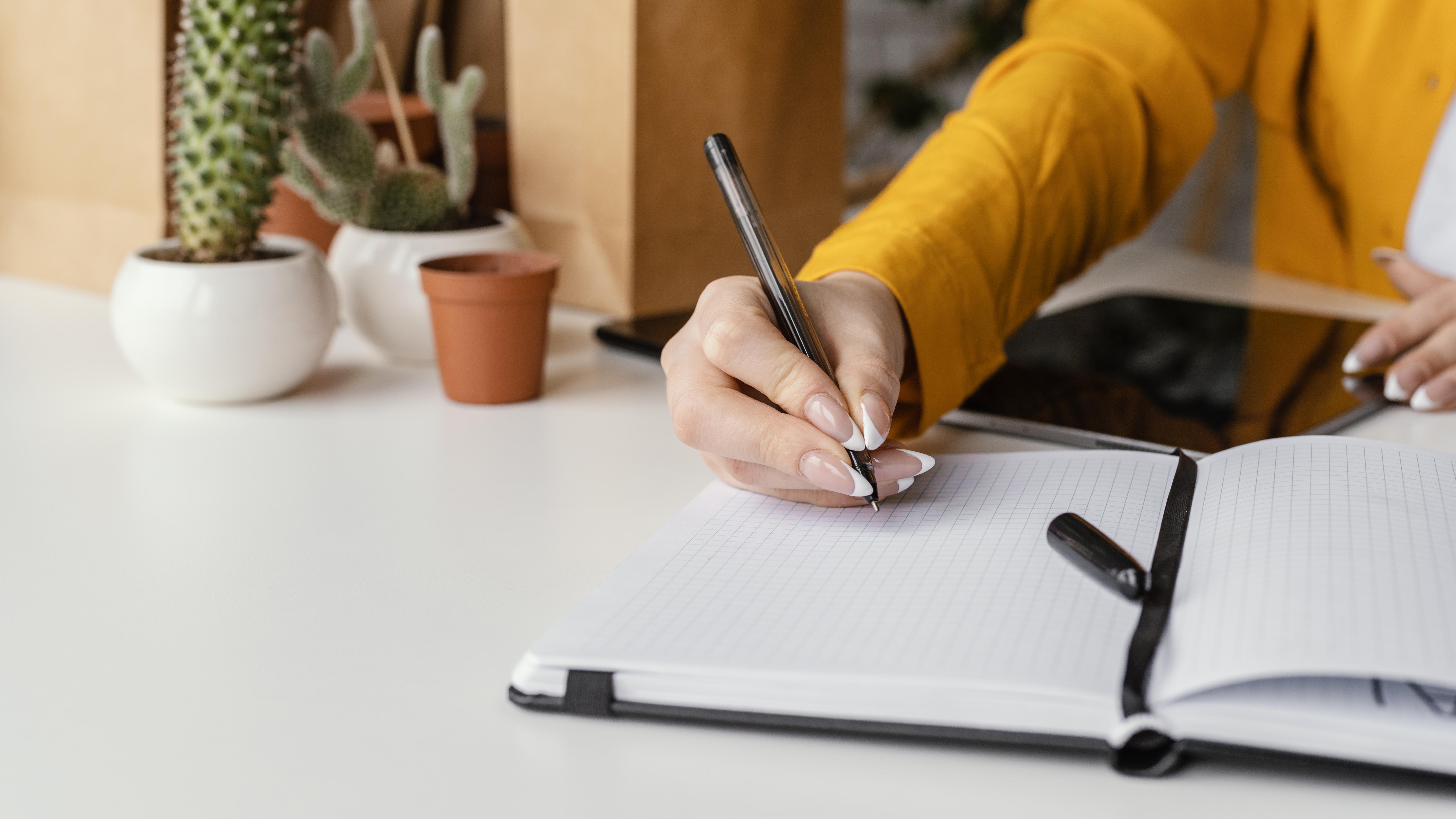Gardener taking notes blank notebook